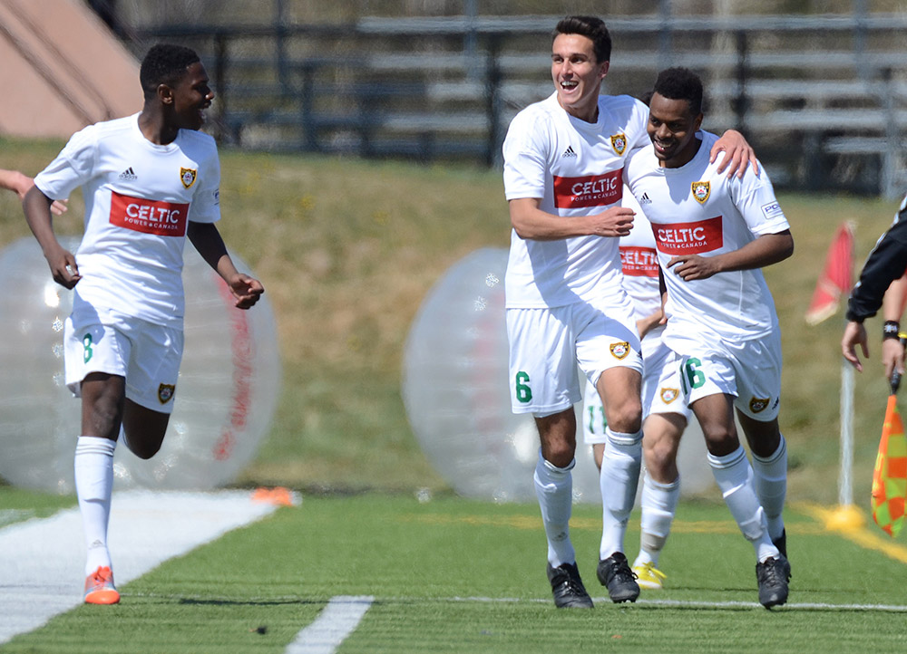 Foothills FC U23's Nat Tecle, right, celebrates with teammates after scoring against the Puget Sound Gunners during their Premier Development League (PDL) match at Hellard Field in Calgary, Alberta Sunday, May 17, 2015. Photo: Stuart Gradon/Total Soccer Project