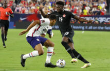 Canada's Alphonso Davies, right, in action against USA in World Cup 2022 Qatar qualifying in Nashville Sunday, Sept. 5, 2021. Photo courtesy Canada Soccer